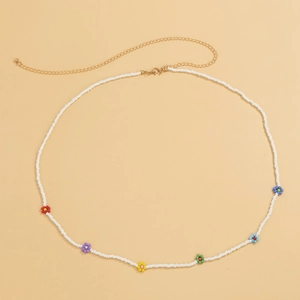 Detail of Bohemian seed bead waist chain with multi-color daisies and golden lobster clasp