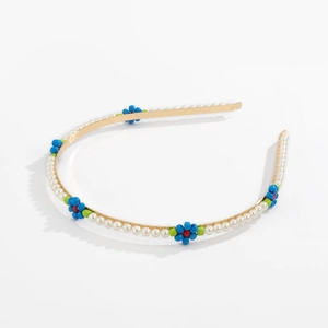 Floral beaded headband with white pearls and blue daisy charms on gold metal