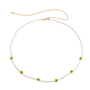 Detail of pink beaded waist chain with colorful flower accents and golden lobster clasp