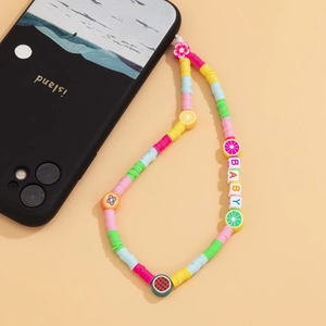 Colorful handmade polymer clay fruit phone charm with BABY beads on a neutral background