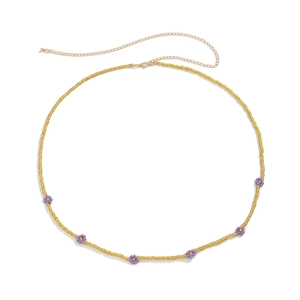 Bohemian yellow beaded waist chain with purple daisy flowers and gold lobster clasp