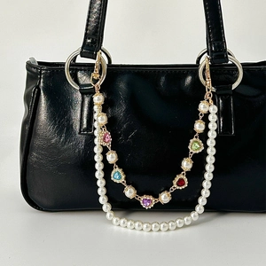 Double-layer pearl bag chain with colorful heart-shaped rhinestones and gold lobster clasps