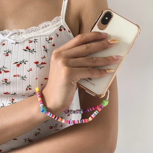 Close-up of a colorful beaded phone strap featuring BABY letters and star charms