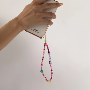 Close-up of handmade rainbow beaded phone strap with BABY letters and star charms