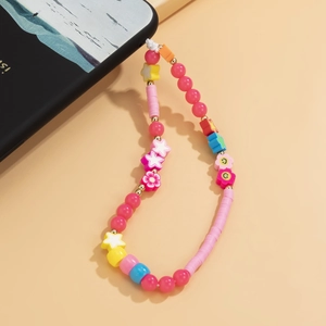 Detail of colorful macaron beaded phone charm with smiling flower and star pendants