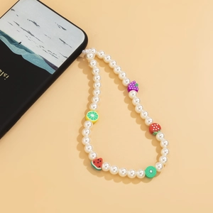 Detail shot of summer phone strap with colorful clay fruit beads and white faux pearls