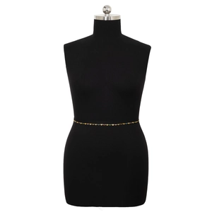 Minimalist gold waist chain with colorful heart pendants on a black female model