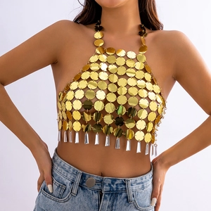 Detail of gold sequin halter top with mesh structure and transparent acrylic pendants