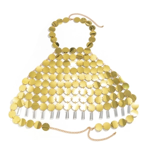 Detail of gold sequin body chain with metallic discs and clear acrylic pendants
