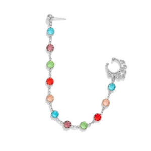 Detail of silver punk nose to ear chain featuring colorful gemstones and ornate metalwork