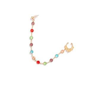 Detail of gold punk tassel earring with nose chain and colorful faux gems for women