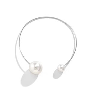 Detail view of silver metal open choker necklace featuring asymmetrical white pearls