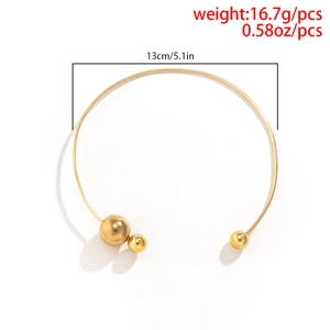 Detail shot of golden metal choker with asymmetric beads including size and weight specs