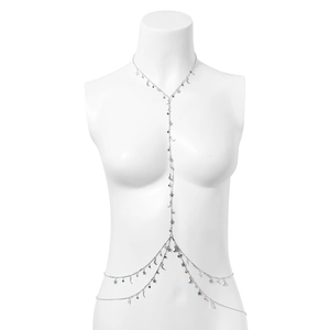 Detailed macro view of silver body chain with colorful star and moon pendant charms