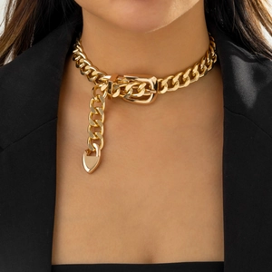 Punk chunky gold chain choker with buckle and heart pendant on a female model