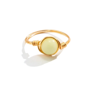 Handcrafted gold wire wrapped ring featuring a luminous light green gemstone bead