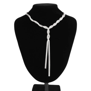 Close-up of twisted silver snake bone chain necklace with a Y-shaped drop design
