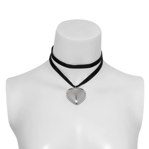 Detail of double-layer black velvet choker with a large polished silver heart pendant
