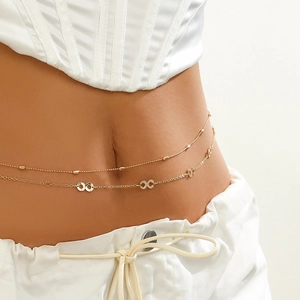 Detail of double-layered gold waist chain featuring infinity symbols on female model