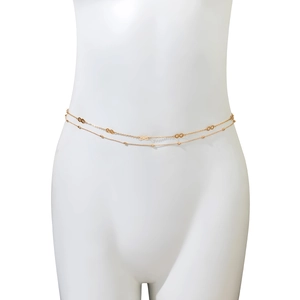 Detail of gold double-layered waist chain featuring infinity symbols and beads on model
