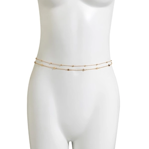 Detail of gold double-layer waist chain with small beads and smiley face pendants