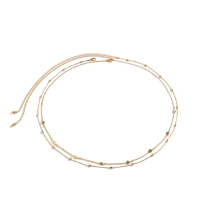 Detailed view of gold-tone double-layered waist chain with small beads and smiley face charms