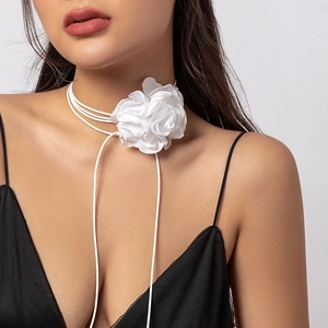 Detail of white silk flower choker with elegant multi-layer petals and tie-up string
