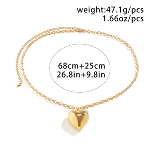 Detailweergave van gouden heupketting met hartvormige hanger en specificaties