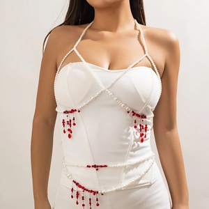 Detailed view of Gothic waist chain featuring white pearls and red blood-drop tassel accents
