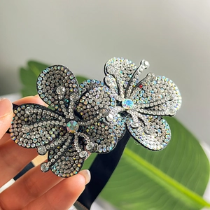 Close-up of sparkling rhinestone flower choker featuring detailed petal craftsmanship