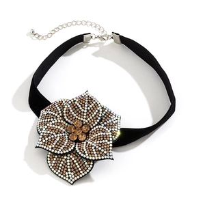 Detail of floral rhinestone choker with black velvet ribbon and adjustable lobster clasp