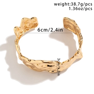 Golden irregular molten lava textured open cuff bracelet with size and weight specs