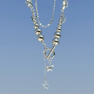 Detailed view of multilayer silver star necklace with CCB beads and OT toggle clasp