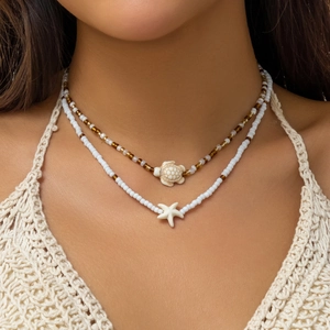 Bohemian double-layer beaded necklace set featuring white sea turtle and starfish pendants