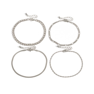 Detail of silver anklet set featuring curb, snake, and figaro chains with lobster clasps