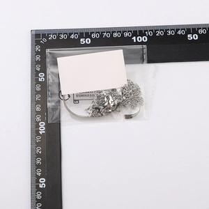 Silver punk heart beaded anklet chain set shown in transparent PE bag with a measuring ruler