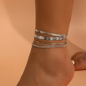 Detailed view of 4pcs silver punk anklet set featuring snake and curb chain textures