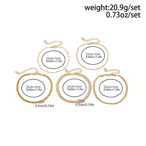 Detailed set of five gold plated punk anklets featuring snake and heart bead chain designs