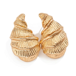 Detailed macro view of gold-plated alloy earrings with a spiral seashell texture design