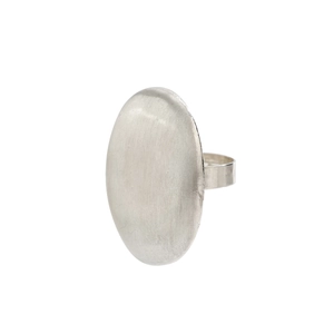 Detail of brushed metal finish on a large oval minimalist silver-tone fashion ring