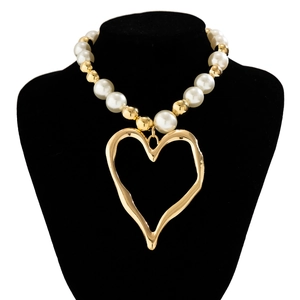 Exaggerated lava heart pendant necklace with mixed faux pearls and gold beads on display