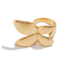 Detail of a golden bow ring featuring a matte metallic finish and adjustable open band