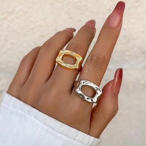 Lava texture gold and silver metallic open geometric rings in irregular hollowed design