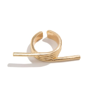 Macro shot of minimalist gold geometric double finger ring with textured metallic finish