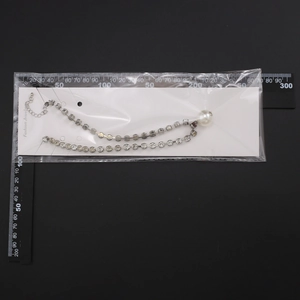 Gothic multilayer pearl necklace detail showing lobster clasp and 24cm length scale