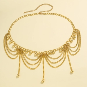 Detail of layered gold metal waist chain featuring small bead charms and lobster clasp