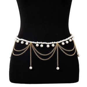 Detail of gold multilayer fringe waist chain with white pearls and elegant tassels