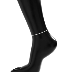 Detailed view of a silver minimalist layered anklet featuring a shimmering beaded chain texture