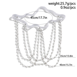 Detailed view of layered faux pearl leg chain with silver metal and elastic band