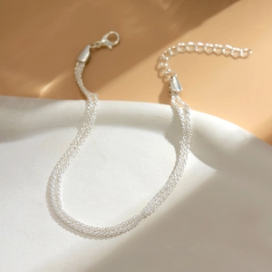 Close-up of multi-layer popcorn chain anklet with lobster clasp and extension chain